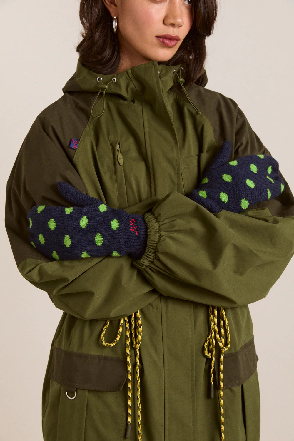 Damson Madder string mittens in Lime Mint Dot